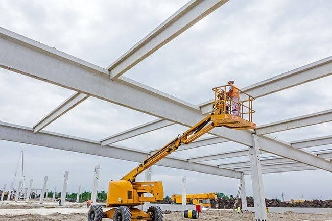 A steel frame under construction with an access platform.